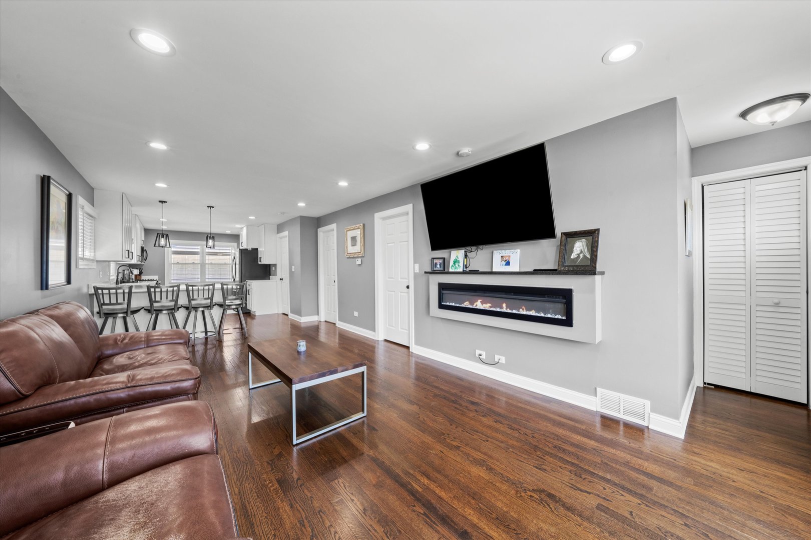7114 West 64th Street Chicago, IL 60638 - Photo 5 of 43 a living room with furniture and a flat screen tv