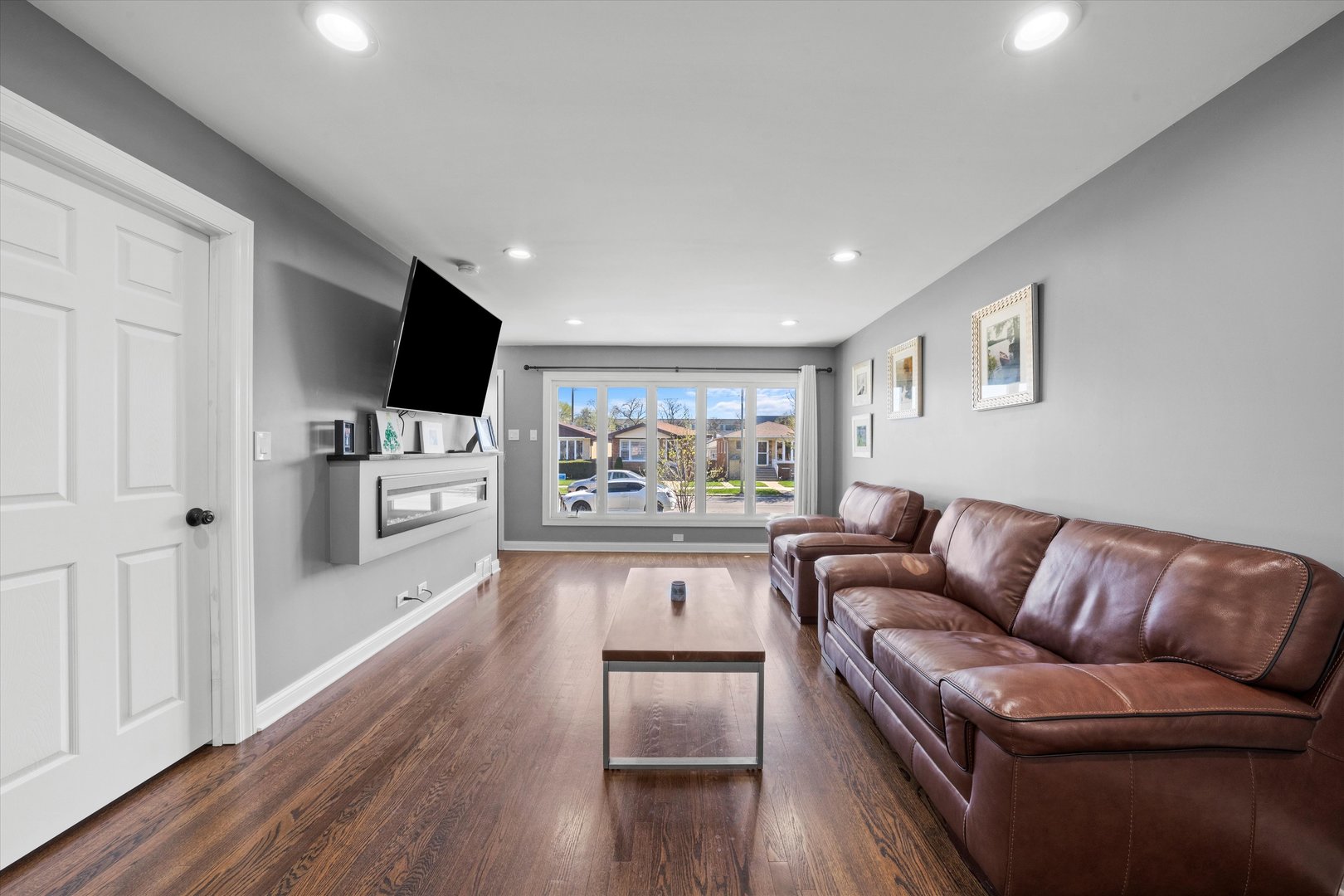 7114 West 64th Street Chicago, IL 60638 - Photo 7 of 43 a living room with furniture fireplace and flat screen tv