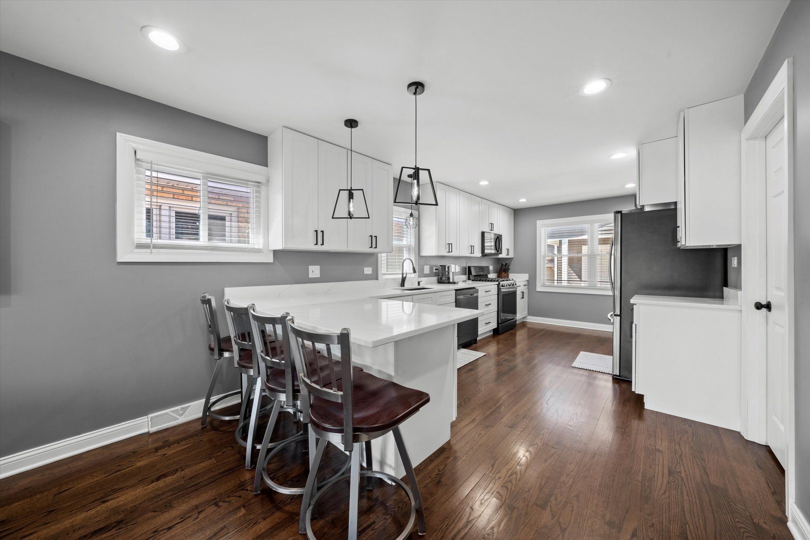 7114 West 64th Street Chicago, IL 60638 - Photo 9 of 43 a view of a dining room with furniture and wooden floor