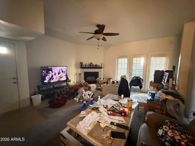 a living room with furniture fireplace and flat screen tv