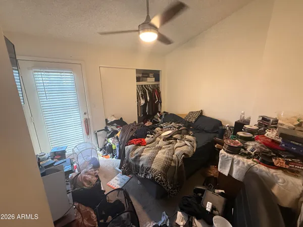 a bed room with a bed and a chandelier