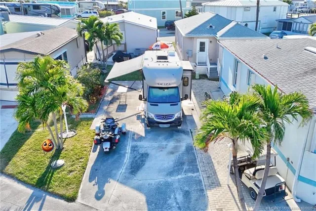 an aerial view of a house with swimming pool