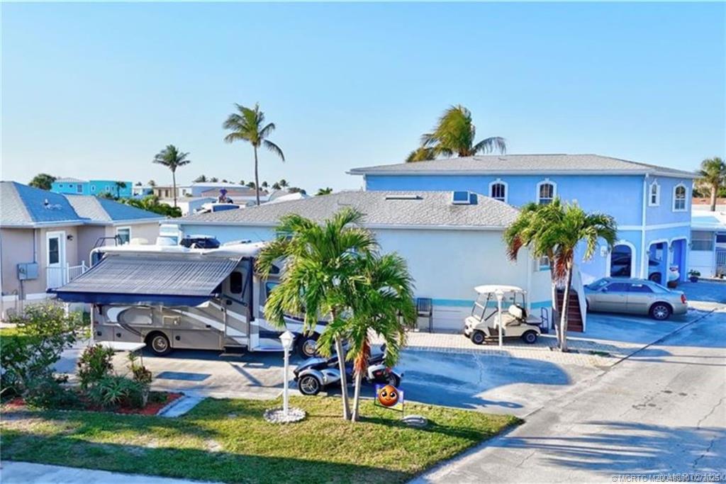 10701 South Ocean Drive, Unit 773 Jensen Beach, FL 34957 - Photo 3 of 13 a view of house with outdoor space and seating area