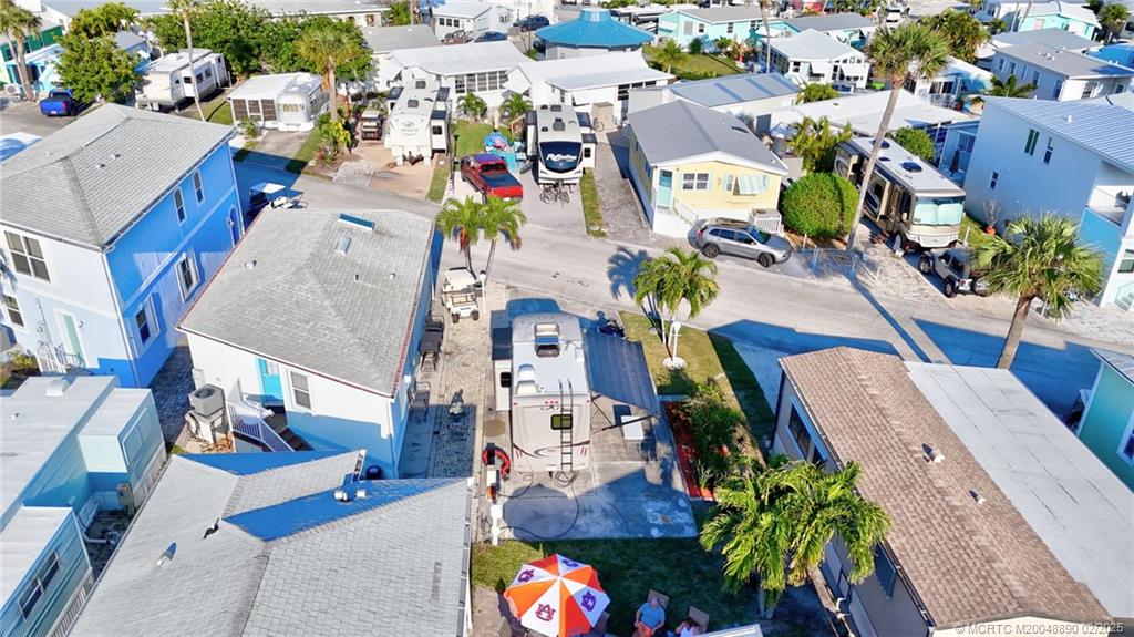 10701 South Ocean Drive, Unit 773 Jensen Beach, FL 34957 - Photo 4 of 13 an aerial view of residential houses with outdoor space