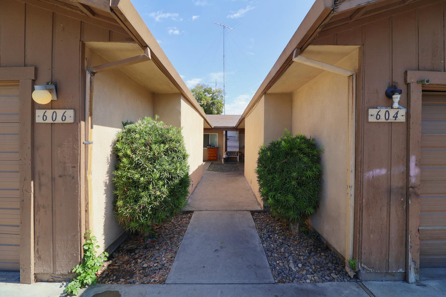 a view of a pathway besides a house