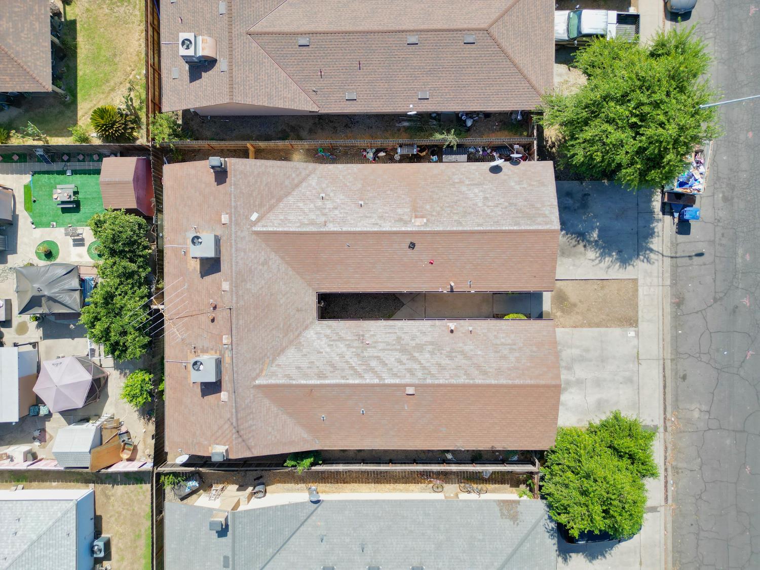 604 Fort Sumpter Drive Modesto, CA 95354 - Photo 9 of 10 an aerial view of a house with a yard and a large tree