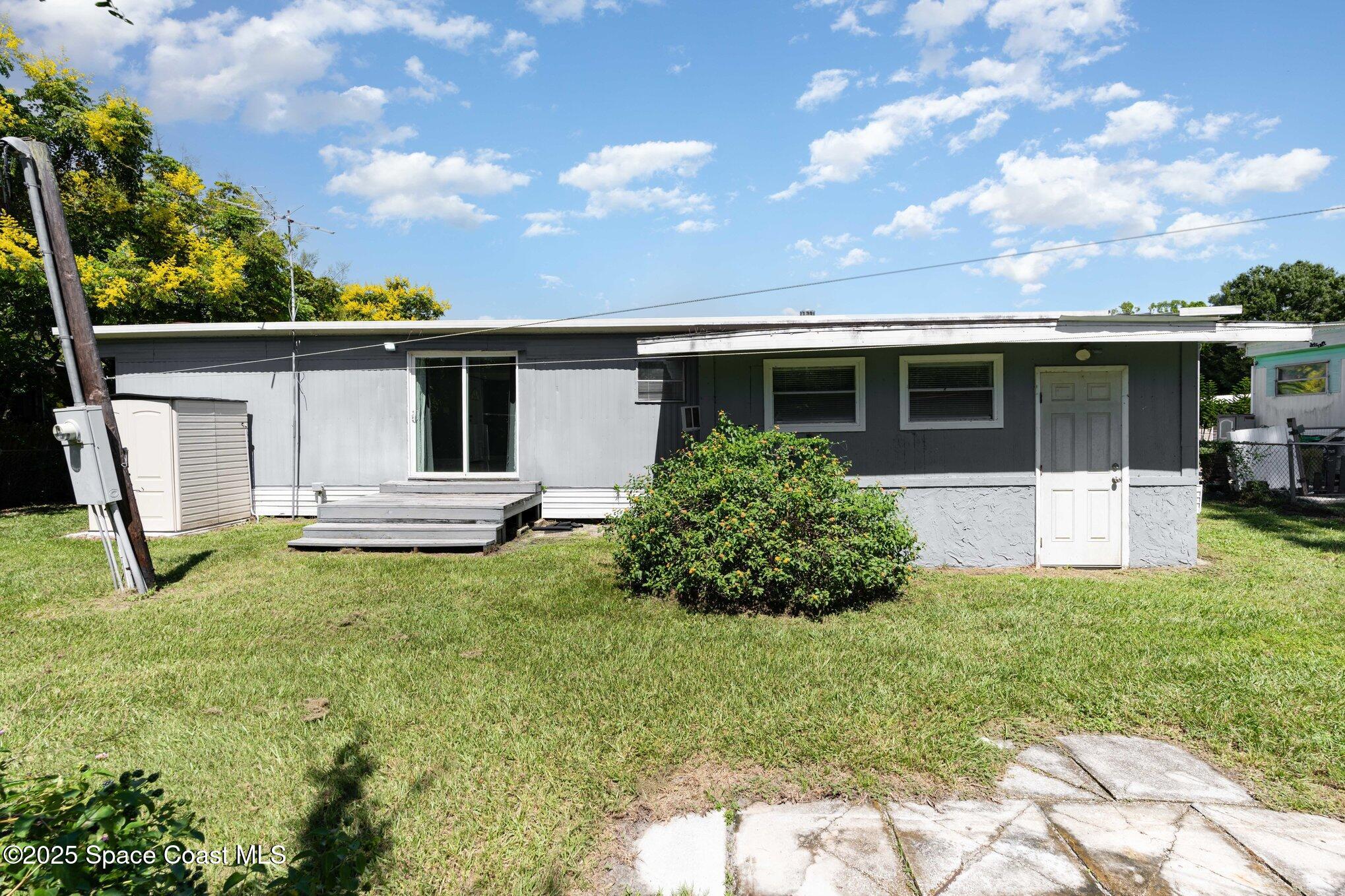 315 Wixie Drive Cocoa, FL 32927 - Photo 14 of 15 a front view of house with yard and green space
