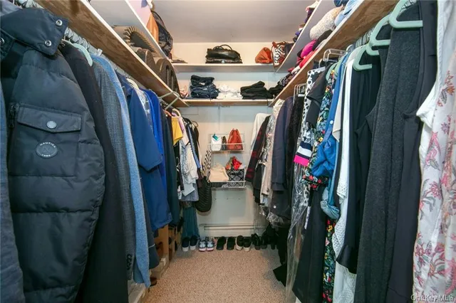 a view of a chair and table in backyard of the house