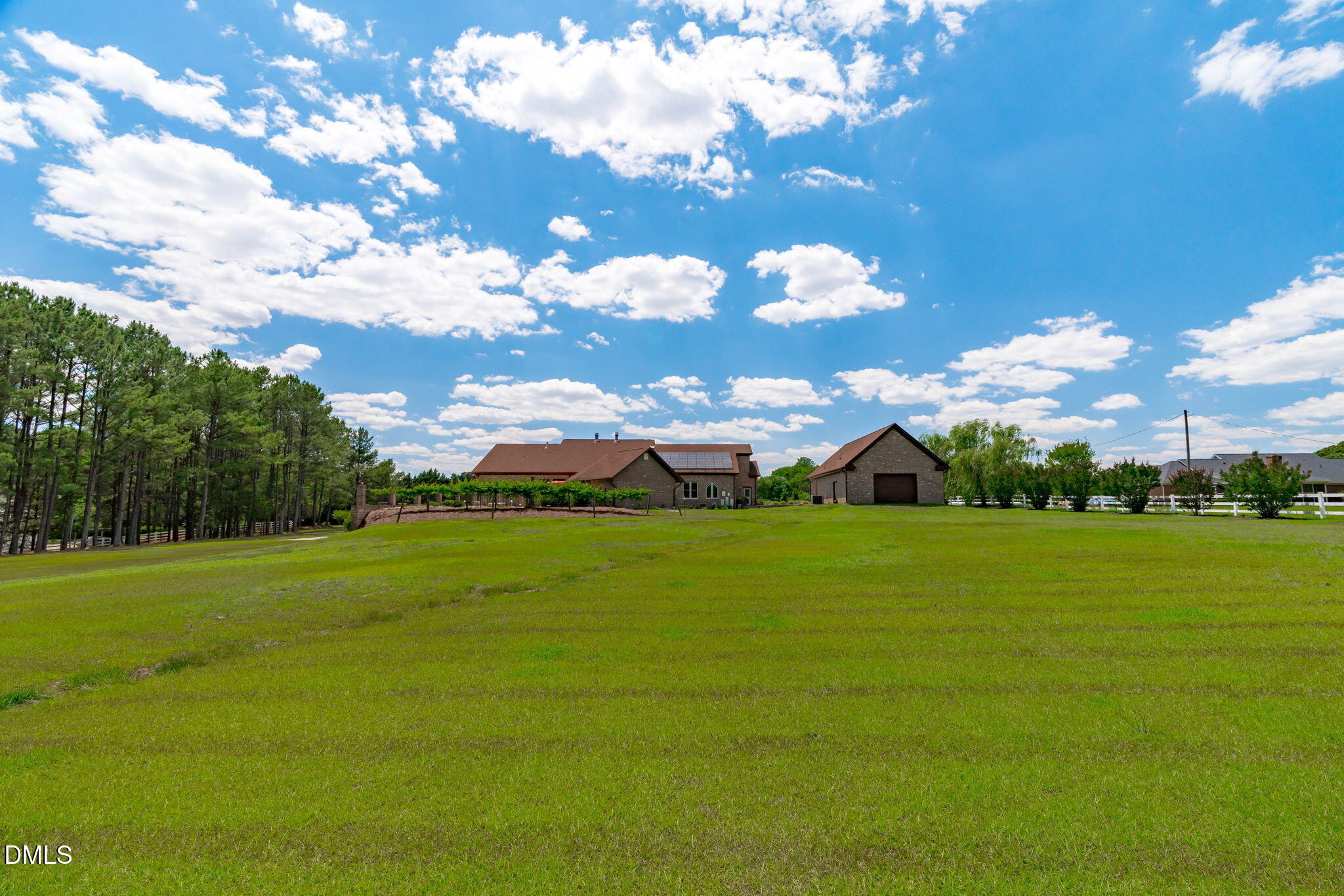 10917 Jordan Road Raleigh, NC 27603 - Photo 53 of 58 a view of a big yard with swimming pool and green space