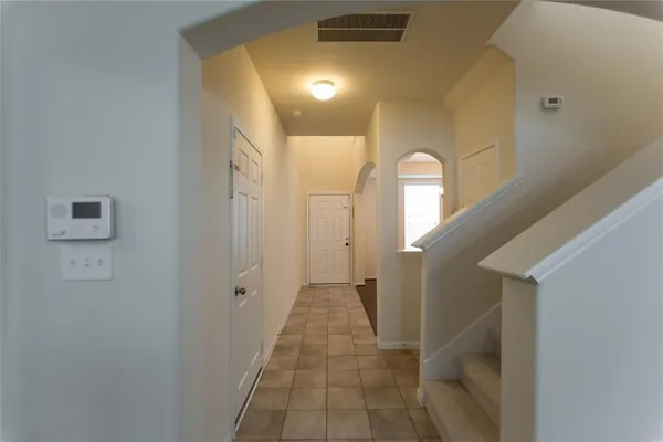 a view of a hallway with windows