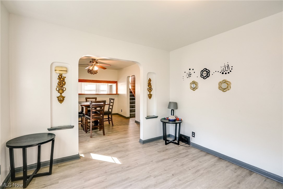 4613 Snow Road Cleveland, OH 44134 - Photo 11 of 33 Entrance foyer with light hardwood floors and ceiling fan