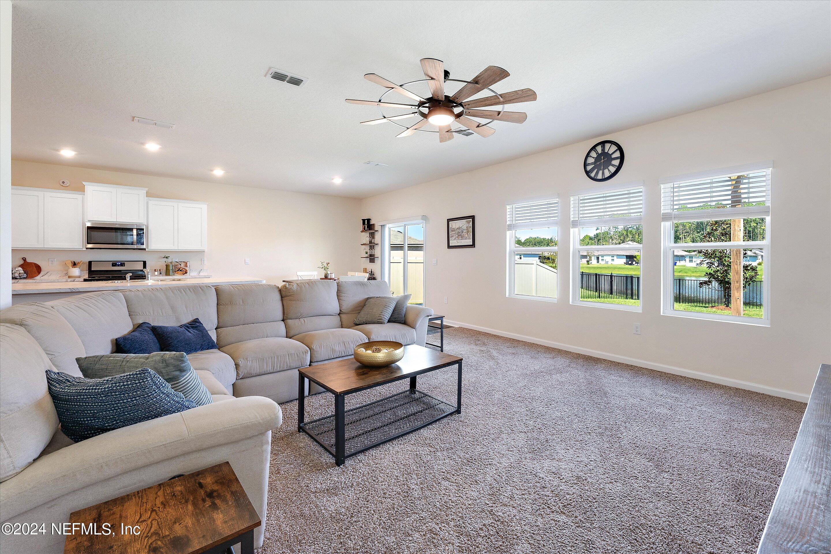 198 Caminha Road St. Augustine, FL 32084 - Photo 12 of 43 a living room with furniture and a large window