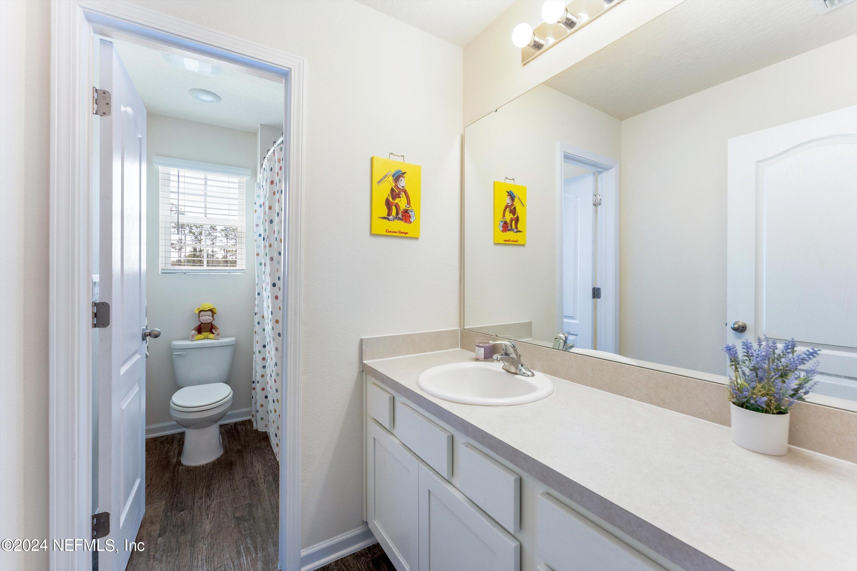 198 Caminha Road St. Augustine, FL 32084 - Photo 23 of 43 a bathroom with a sink and a mirror