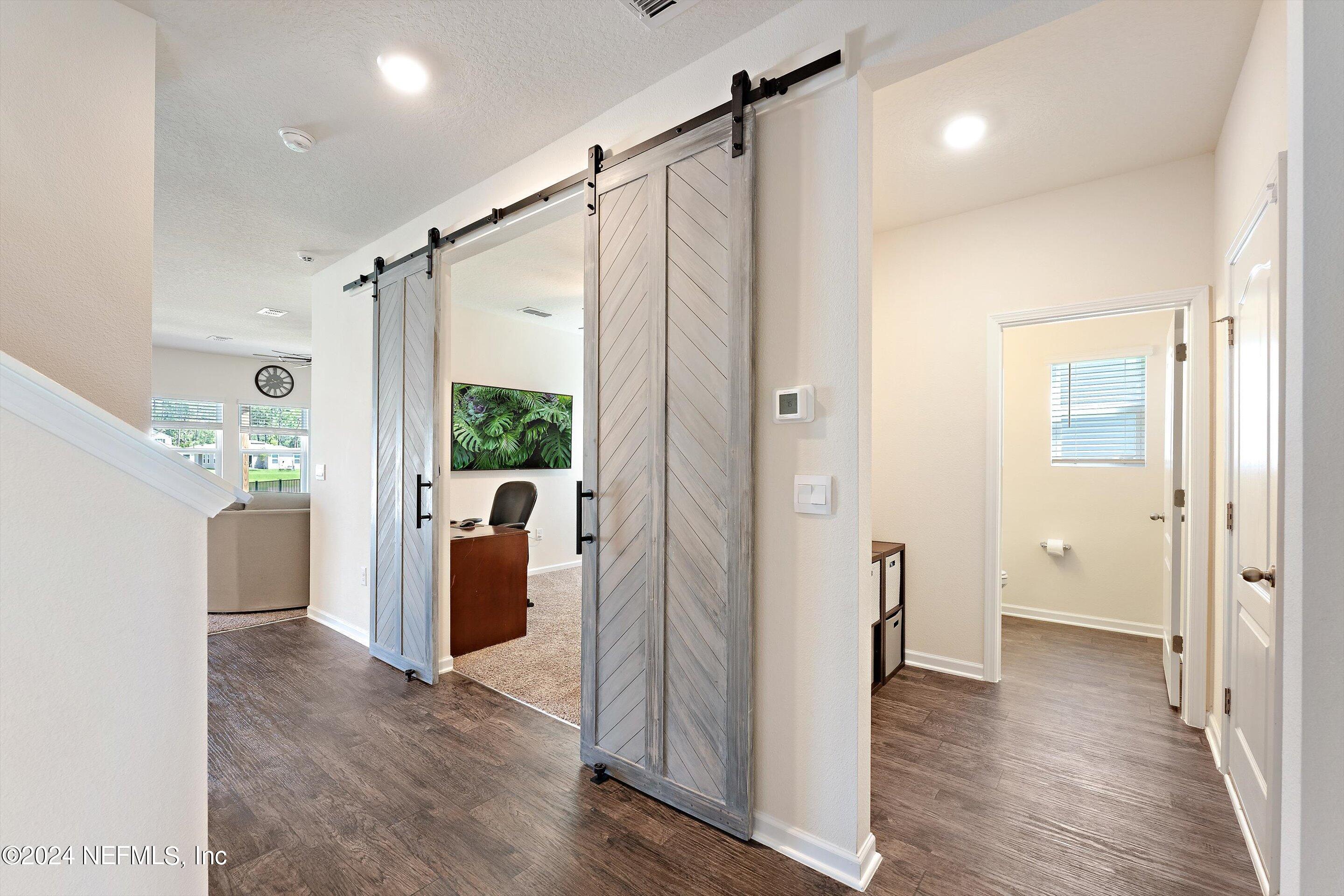 198 Caminha Road St. Augustine, FL 32084 - Photo 4 of 43 a view of a bathroom with a shower and a tub