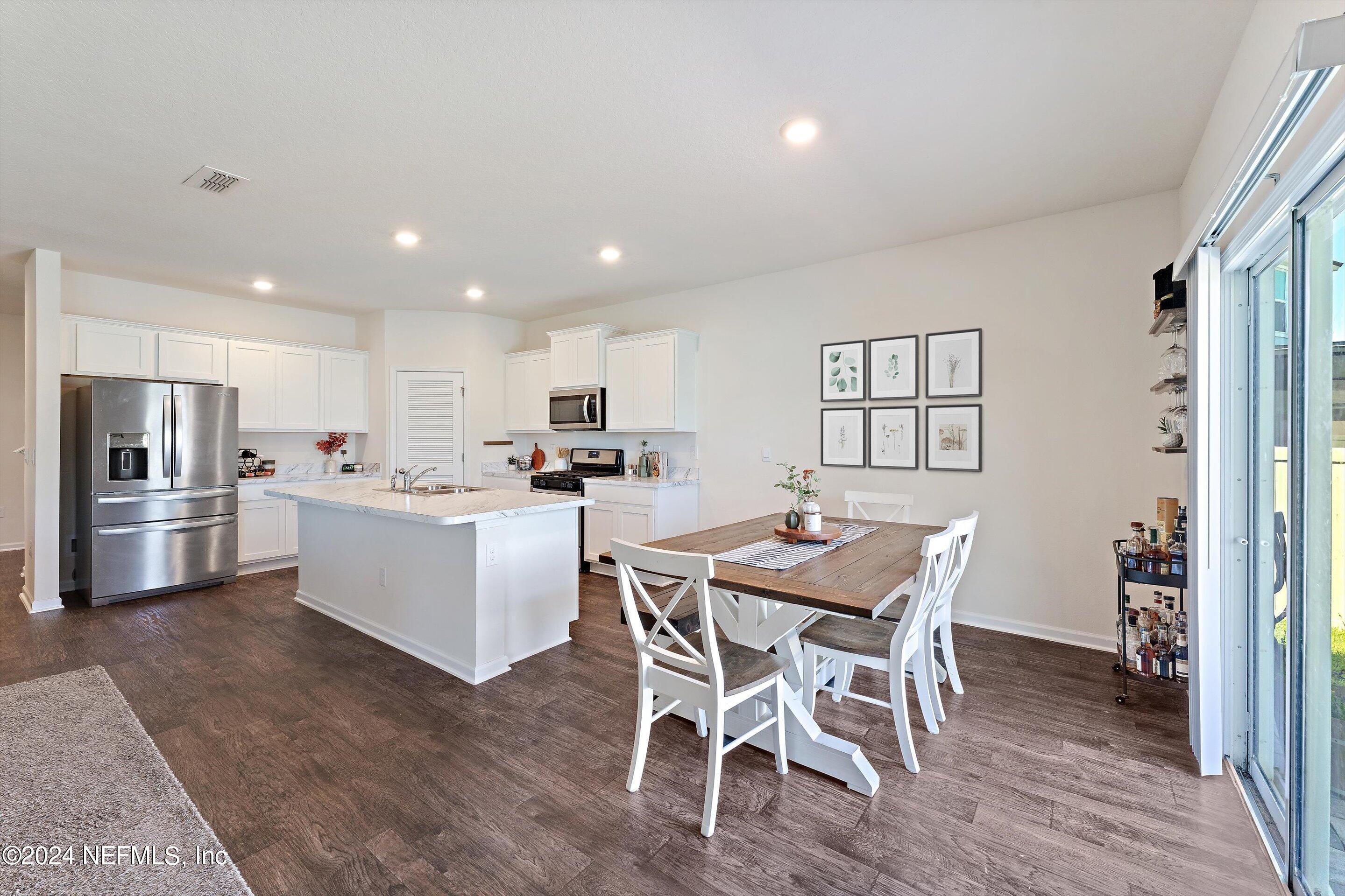 198 Caminha Road St. Augustine, FL 32084 - Photo 10 of 43 a kitchen with a table and chairs in it