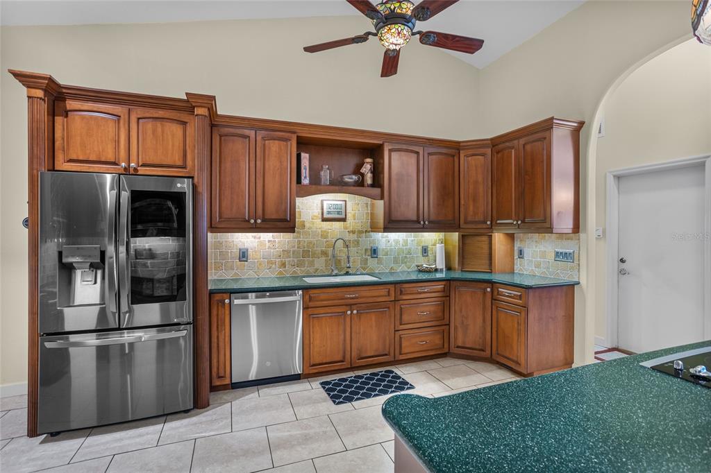 14612 Bray Road Orlando, FL 32832 - Photo 15 of 33 a kitchen with stainless steel appliances granite countertop a refrigerator and a sink