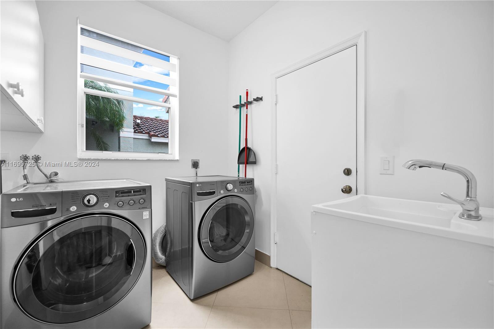 2497 Southwest 163rd Avenue Miramar, FL 33027 - Photo 18 of 50 a utility room with sink dryer and washer