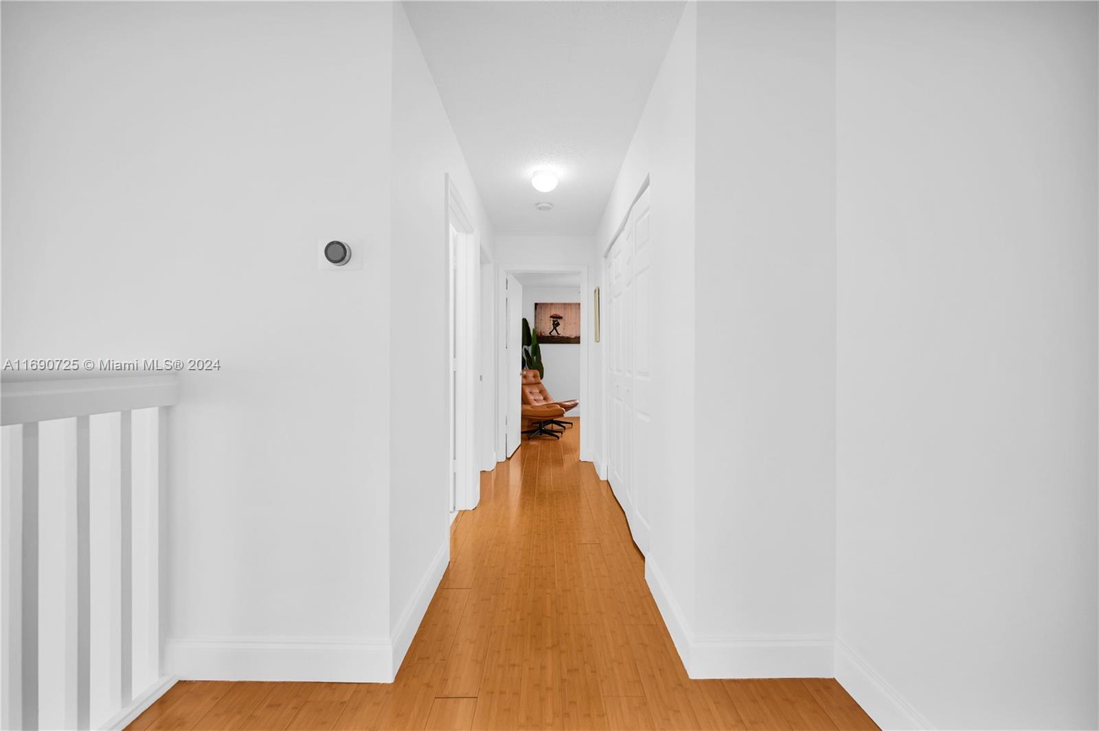 2497 Southwest 163rd Avenue Miramar, FL 33027 - Photo 26 of 50 a view of a hallway with wooden floor and staircase