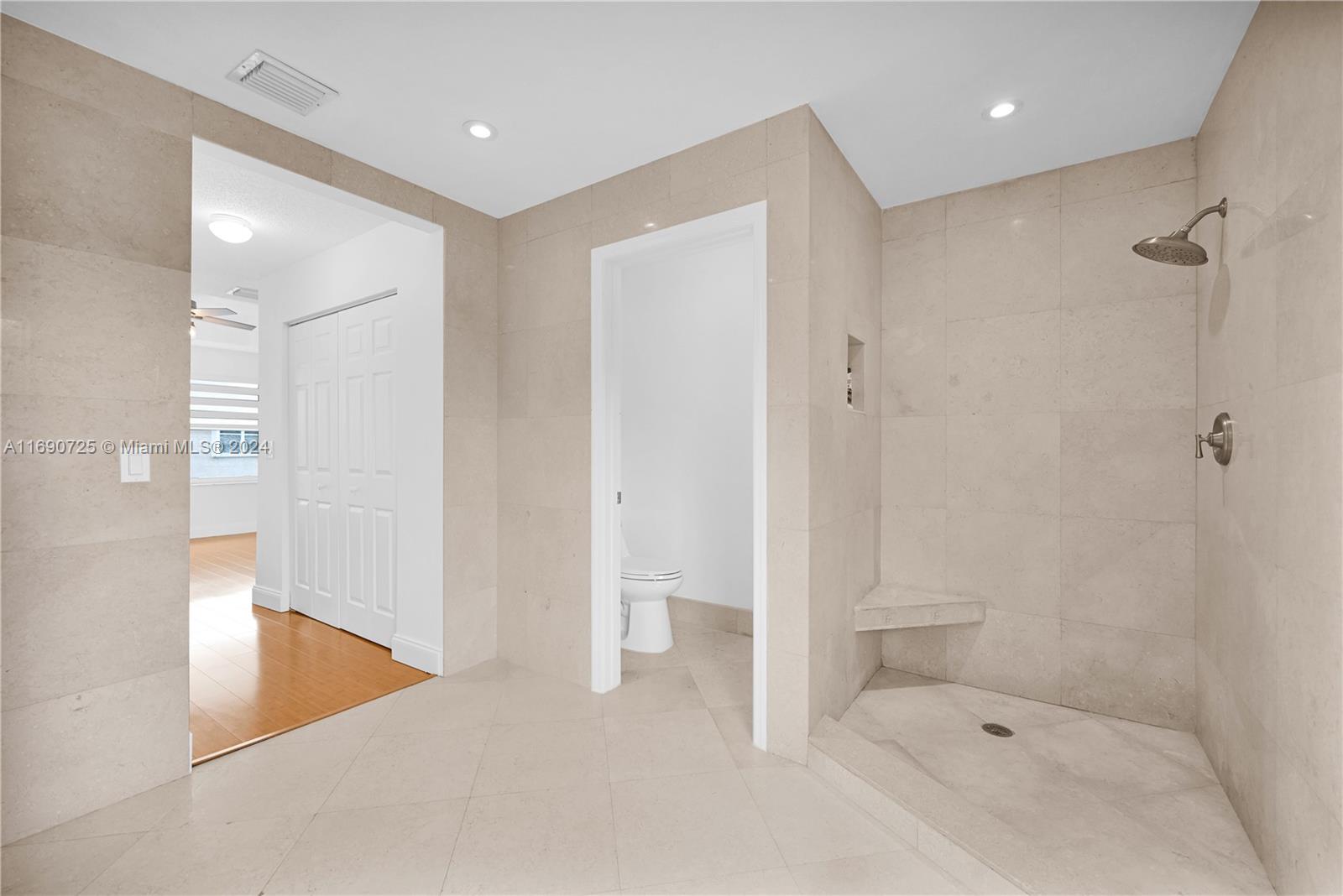 2497 Southwest 163rd Avenue Miramar, FL 33027 - Photo 34 of 50 a bathroom with a bathtub and a shower