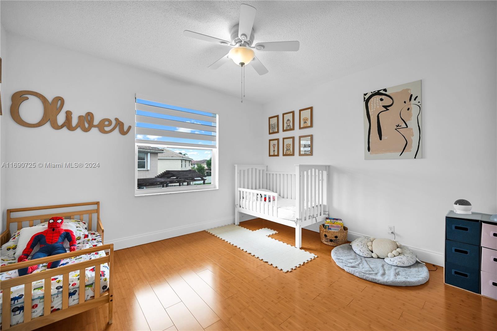 2497 Southwest 163rd Avenue Miramar, FL 33027 - Photo 36 of 50 a bedroom with furniture and a bed
