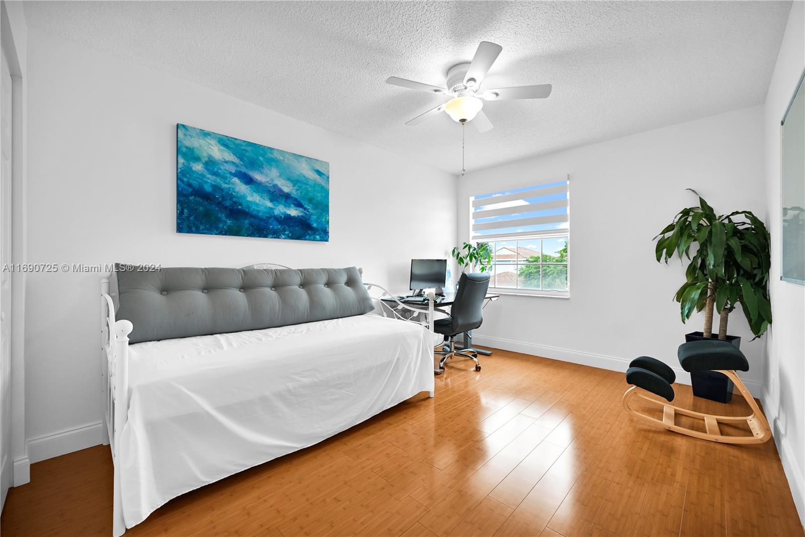 2497 Southwest 163rd Avenue Miramar, FL 33027 - Photo 38 of 50 a living room with furniture and a flat screen tv