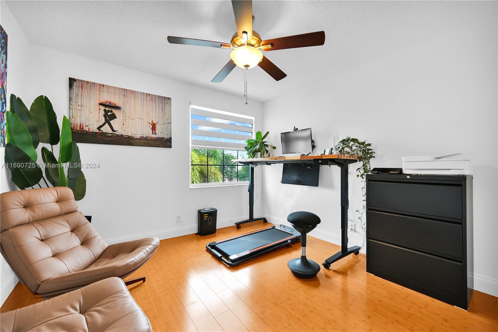 2497 Southwest 163rd Avenue Miramar, FL 33027 - Photo 40 of 50 a bedroom with a bed and a chandelier