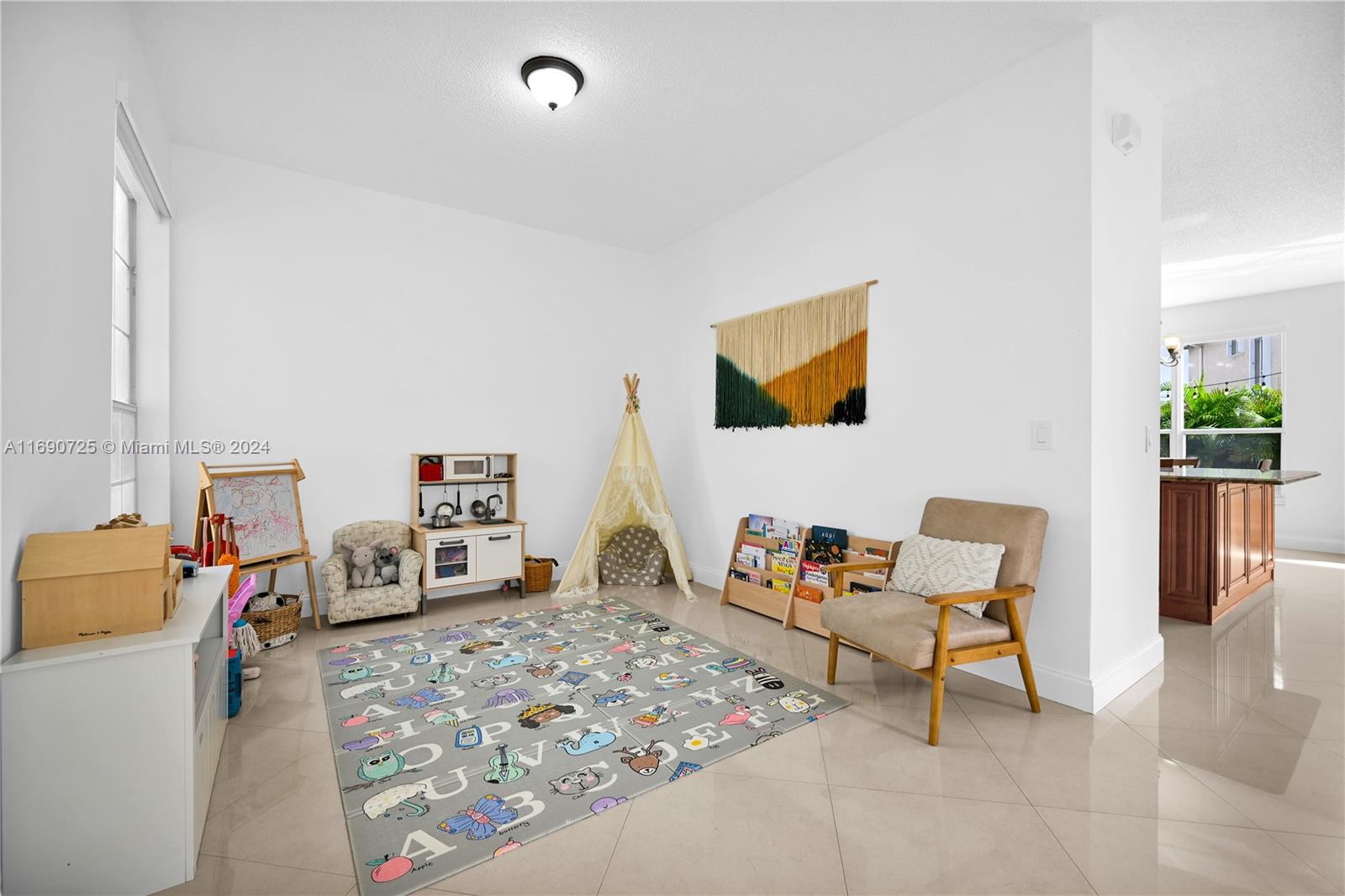 2497 Southwest 163rd Avenue Miramar, FL 33027 - Photo 4 of 50 a living room with furniture and a couch