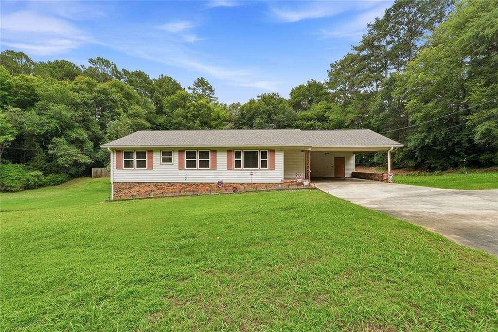 399 Donahoo Road Southeast Silver Creek, GA 30173 - Photo 2 of 22 a view of a house with a yard and potted plants