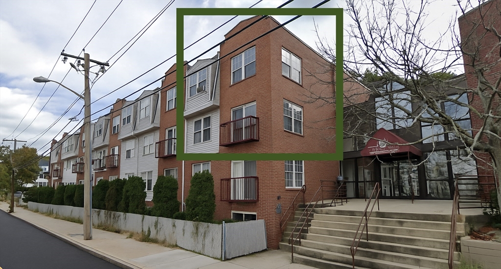 20 Knox Street, Unit 23 Lawrence, MA 01841 - Photo 1 of 15 a view of a building with brick walls