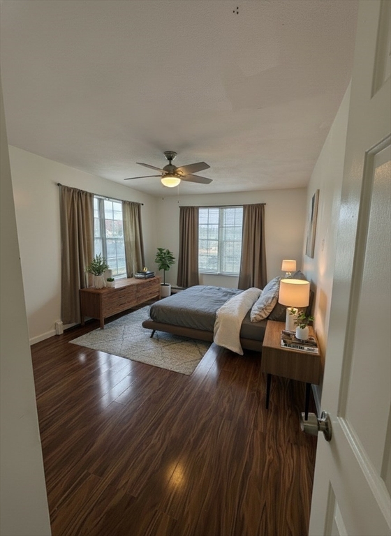 20 Knox Street, Unit 23 Lawrence, MA 01841 - Photo 13 of 15 a bedroom with furniture and wooden floor