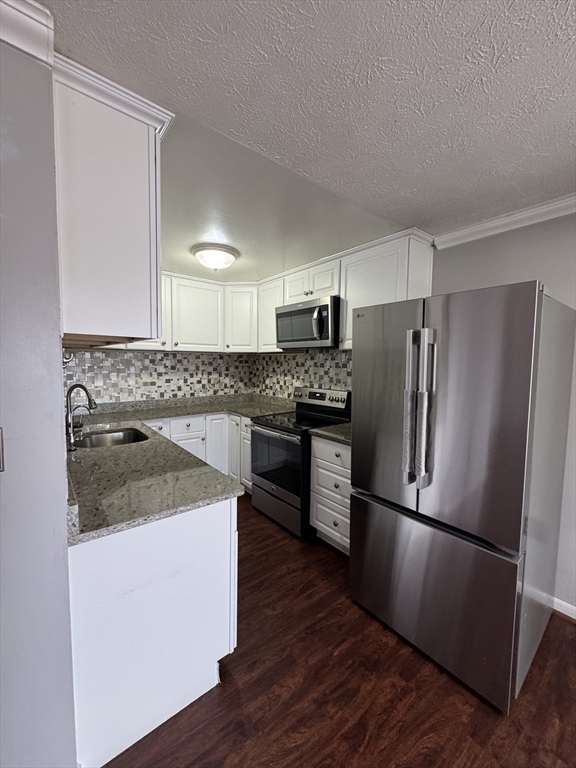 20 Knox Street, Unit 23 Lawrence, MA 01841 - Photo 3 of 15 a kitchen with a refrigerator sink and microwave