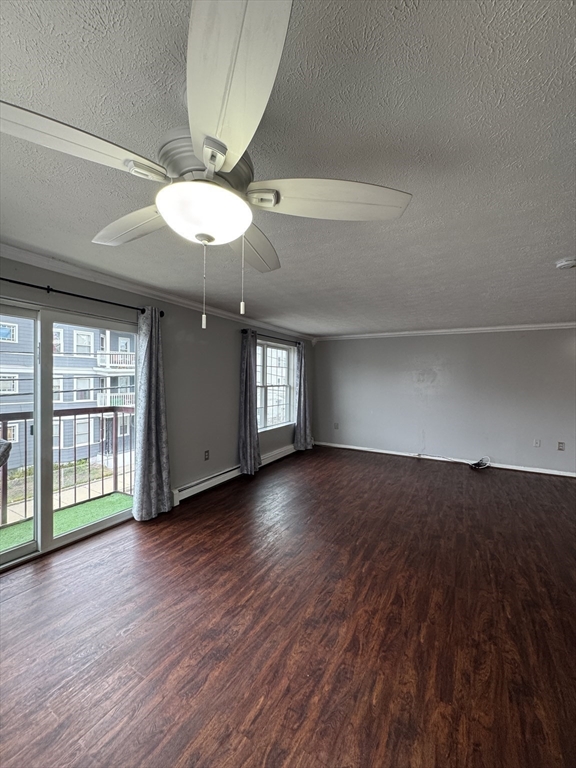 20 Knox Street, Unit 23 Lawrence, MA 01841 - Photo 4 of 15 a view of an empty room with wooden floor and a window