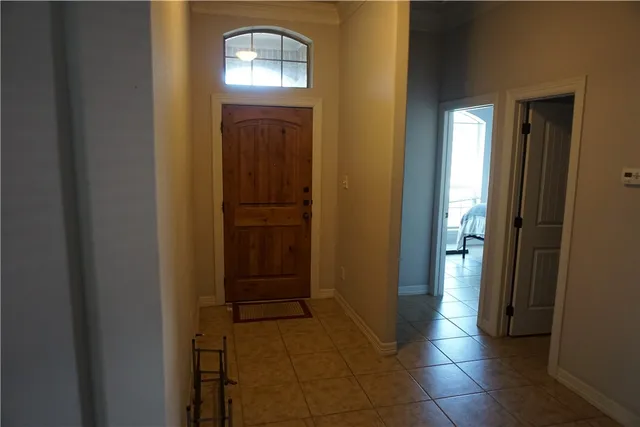 a view of a hallway with front door