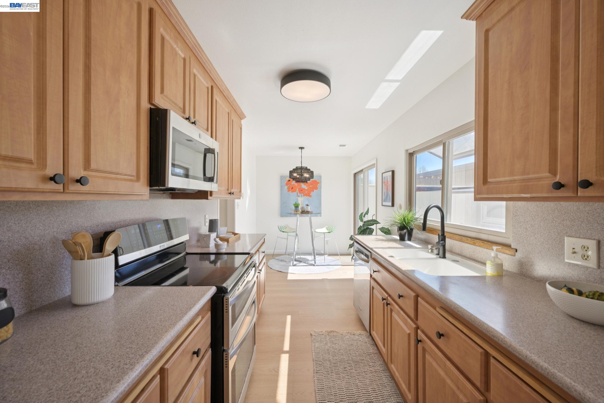 3201 Phoenix Lane Alameda, CA 94502 - Photo 12 of 58 a kitchen with granite countertop a sink dishwasher stove and cabinets