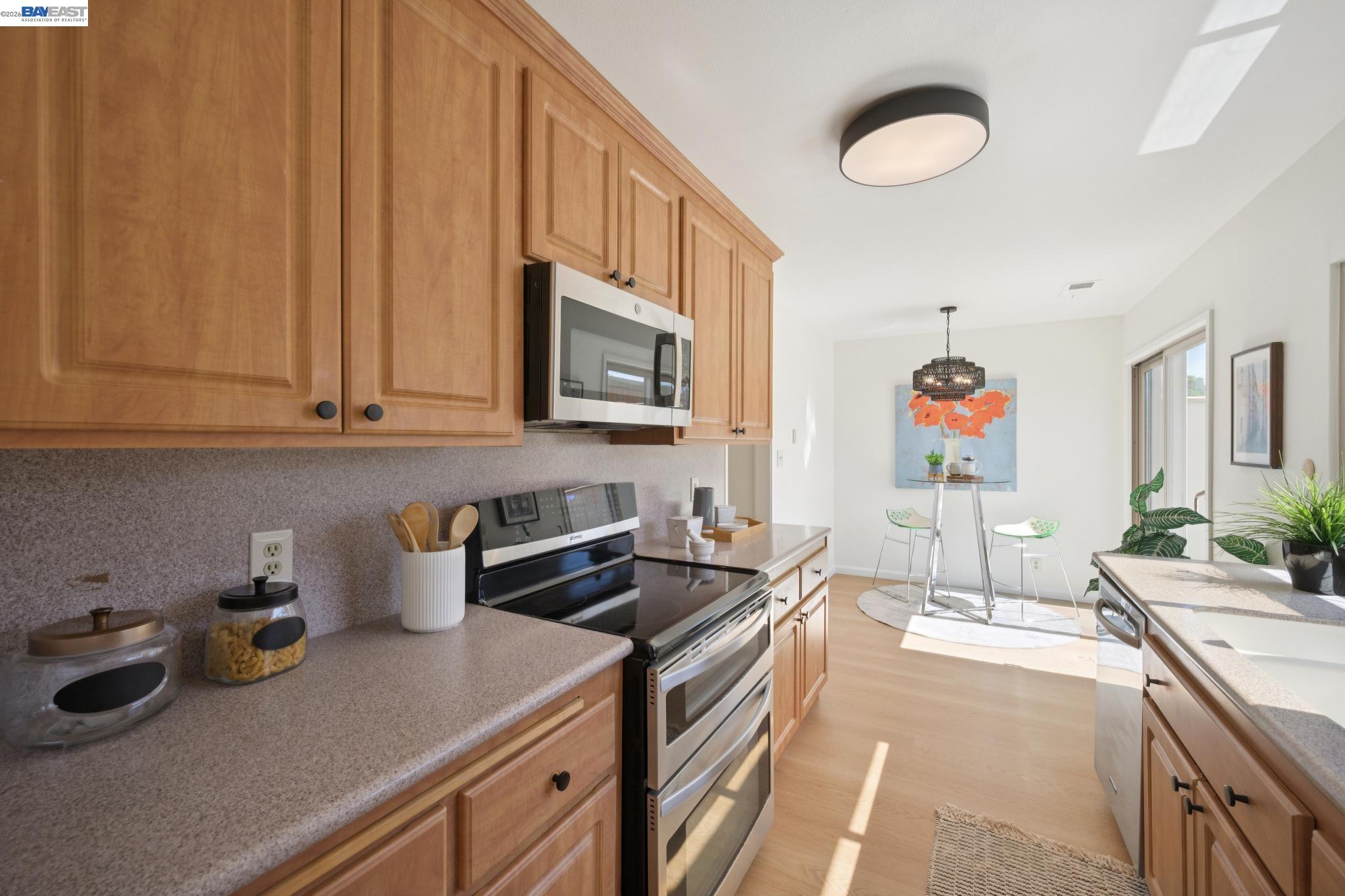 3201 Phoenix Lane Alameda, CA 94502 - Photo 14 of 58 a kitchen with sink a stove and cabinets