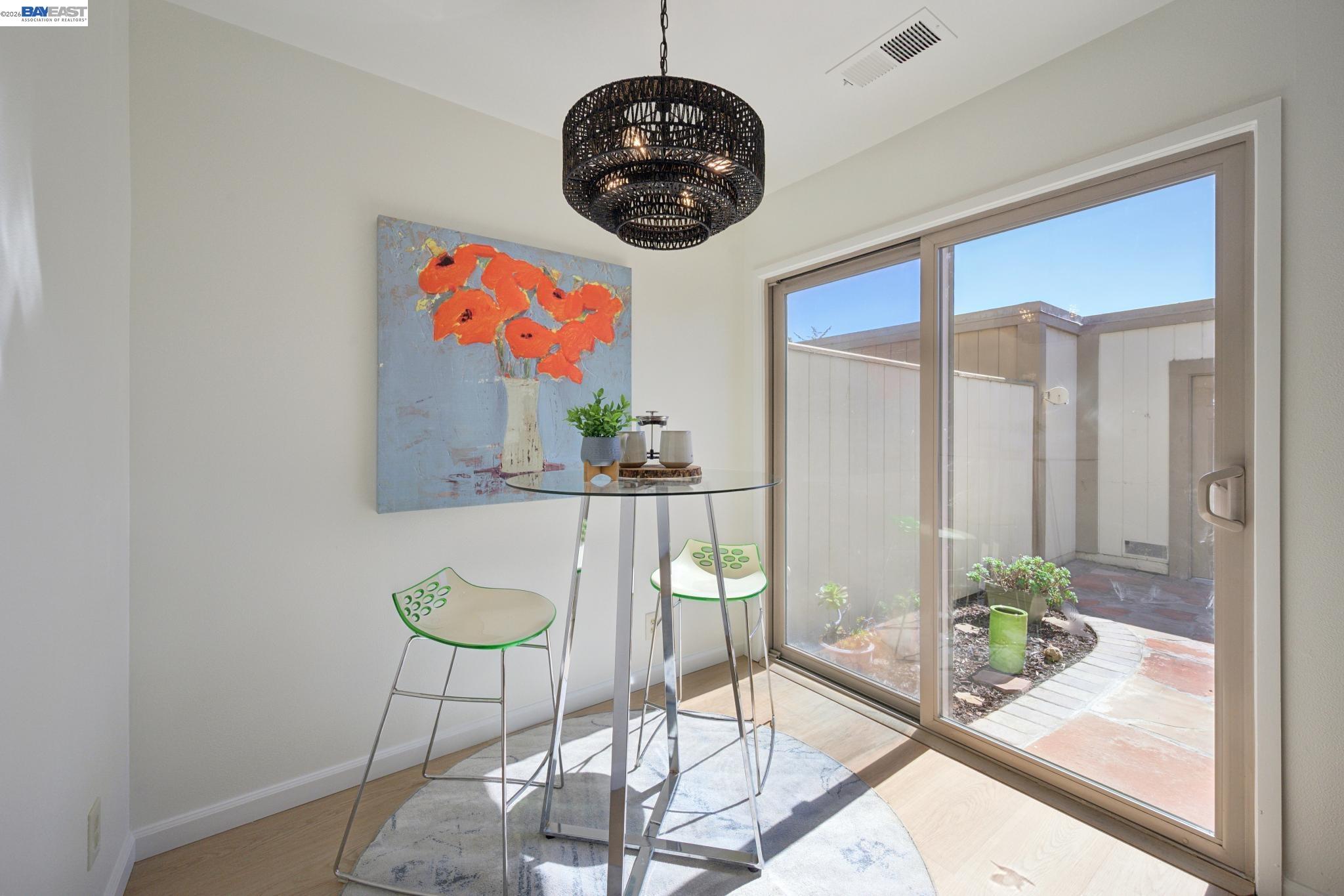 3201 Phoenix Lane Alameda, CA 94502 - Photo 19 of 58 a living room with furniture and a chandelier