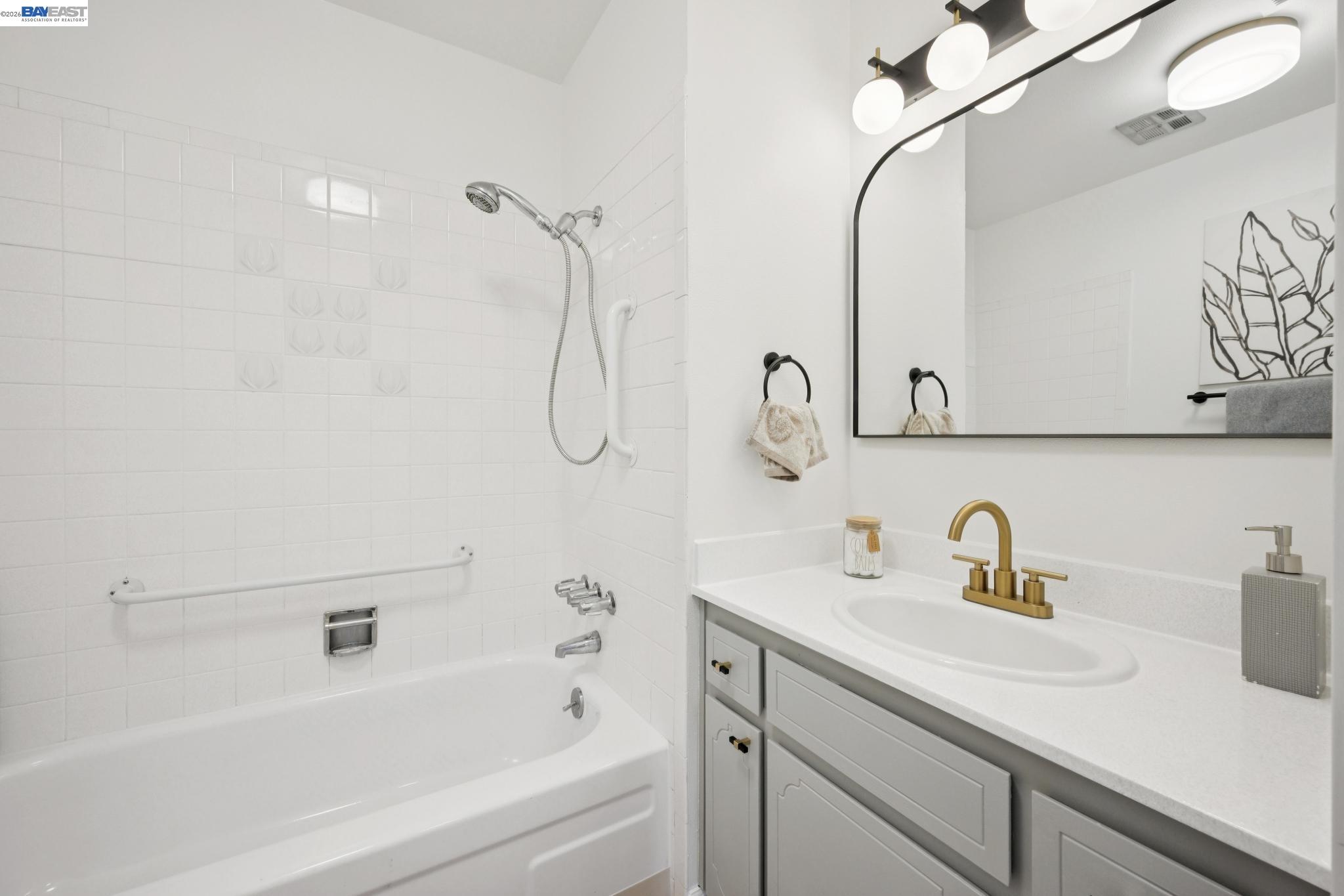 3201 Phoenix Lane Alameda, CA 94502 - Photo 21 of 58 a bathroom with a sink a vanity and a shower