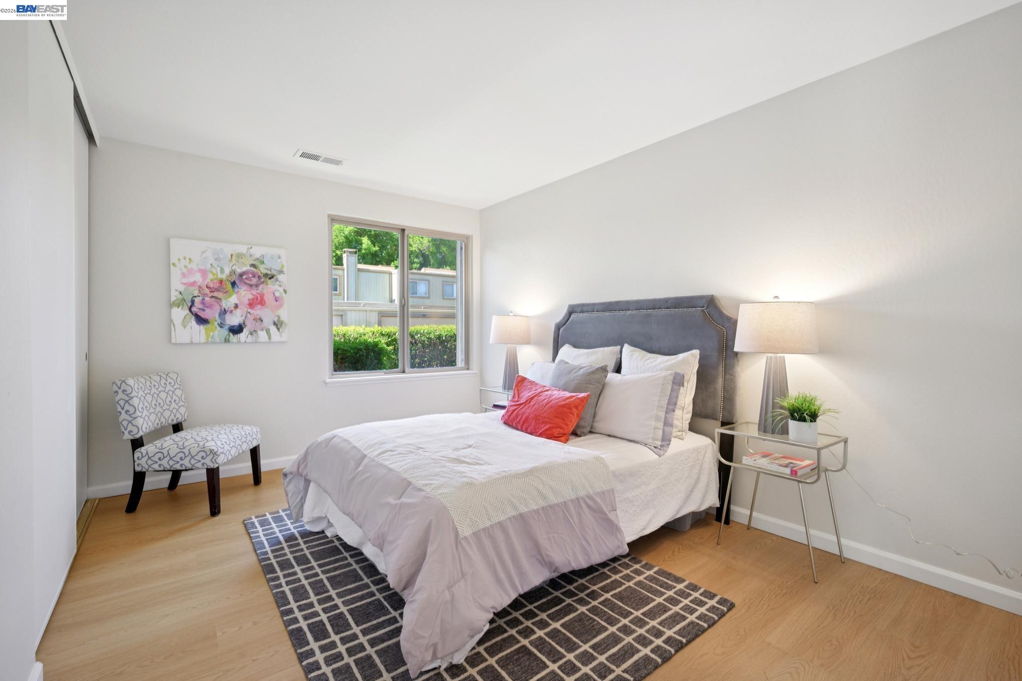 3201 Phoenix Lane Alameda, CA 94502 - Photo 23 of 58 a bedroom with a bed and a window