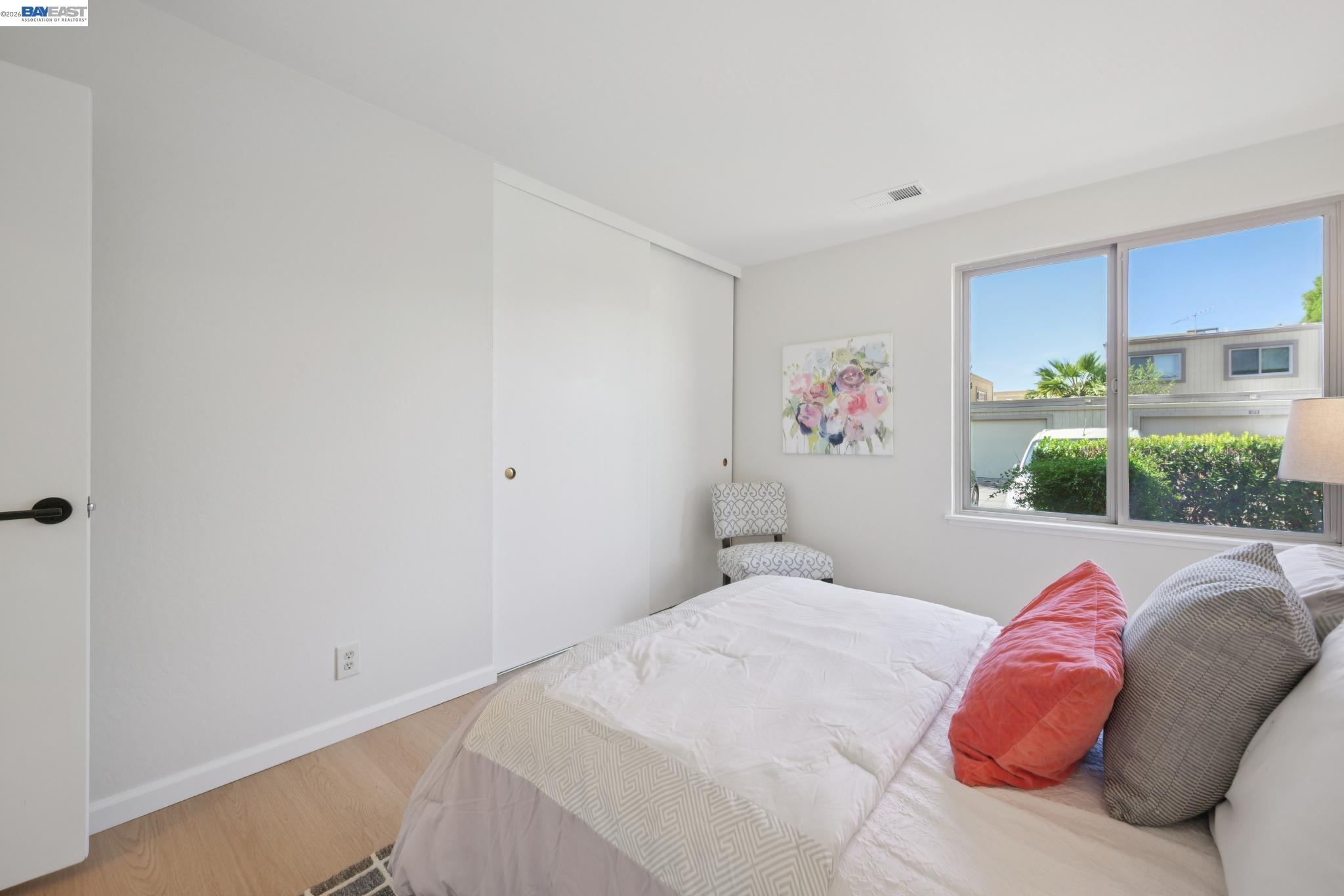 3201 Phoenix Lane Alameda, CA 94502 - Photo 24 of 58 a bedroom with a bed and a painting on the wall