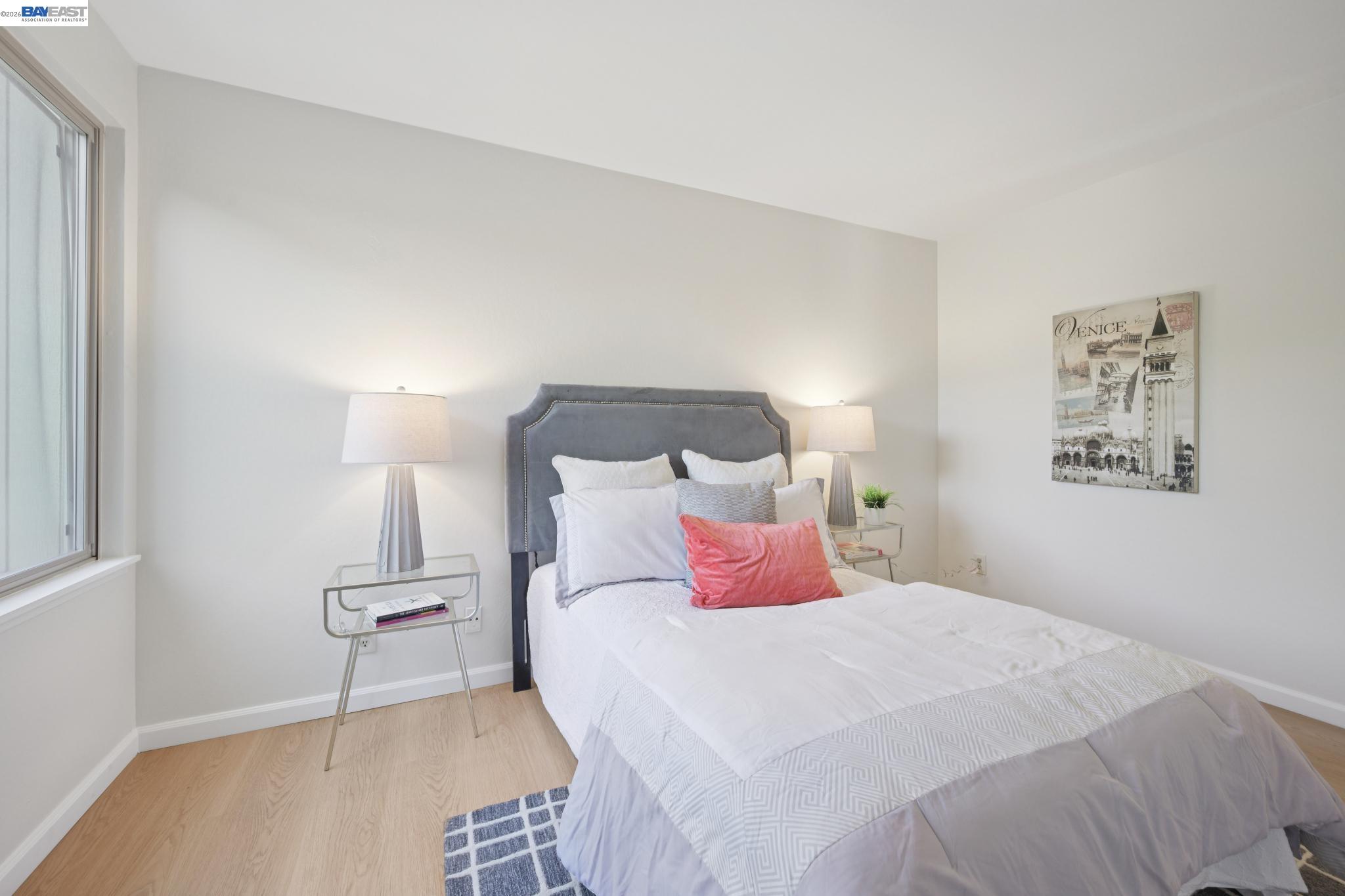 3201 Phoenix Lane Alameda, CA 94502 - Photo 25 of 58 a bedroom with a bed and a night stand