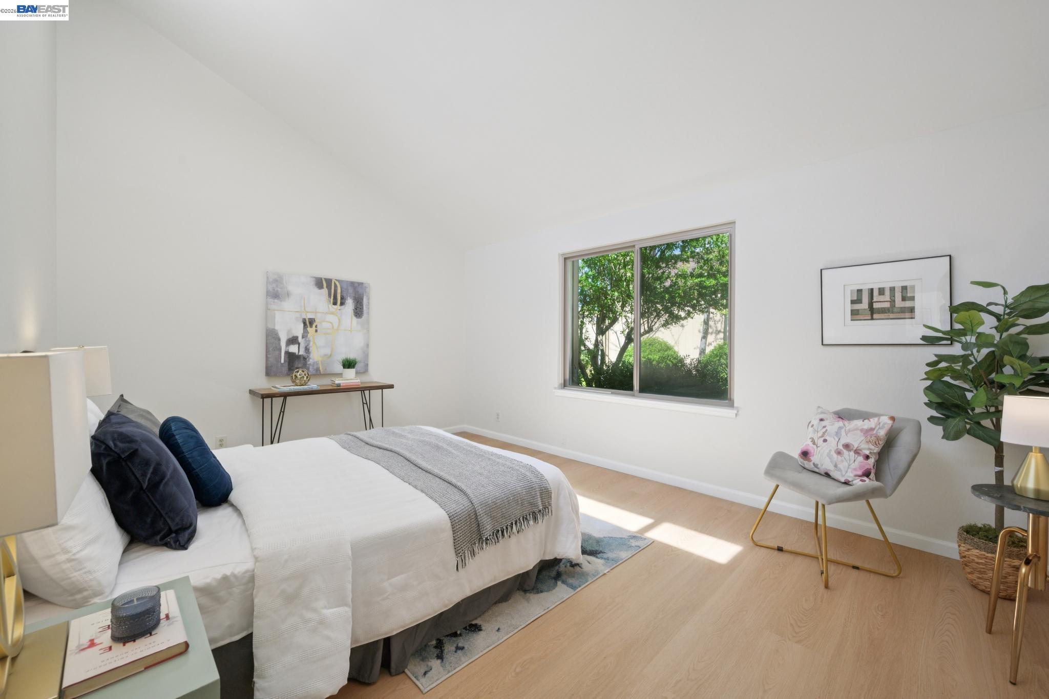 3201 Phoenix Lane Alameda, CA 94502 - Photo 26 of 58 a bedroom with a bed and a chair