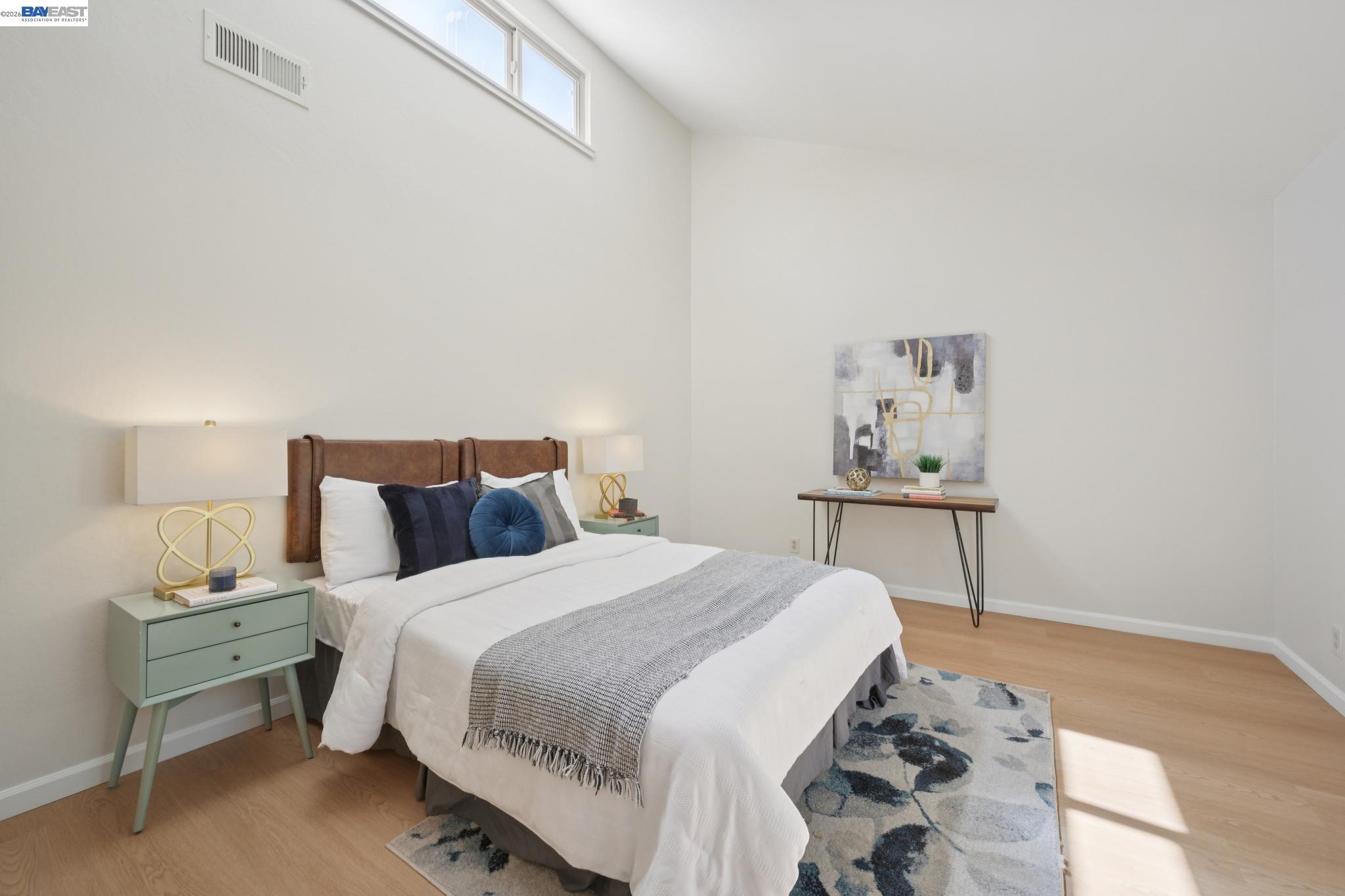 3201 Phoenix Lane Alameda, CA 94502 - Photo 28 of 58 a bedroom with a bed and a table in it