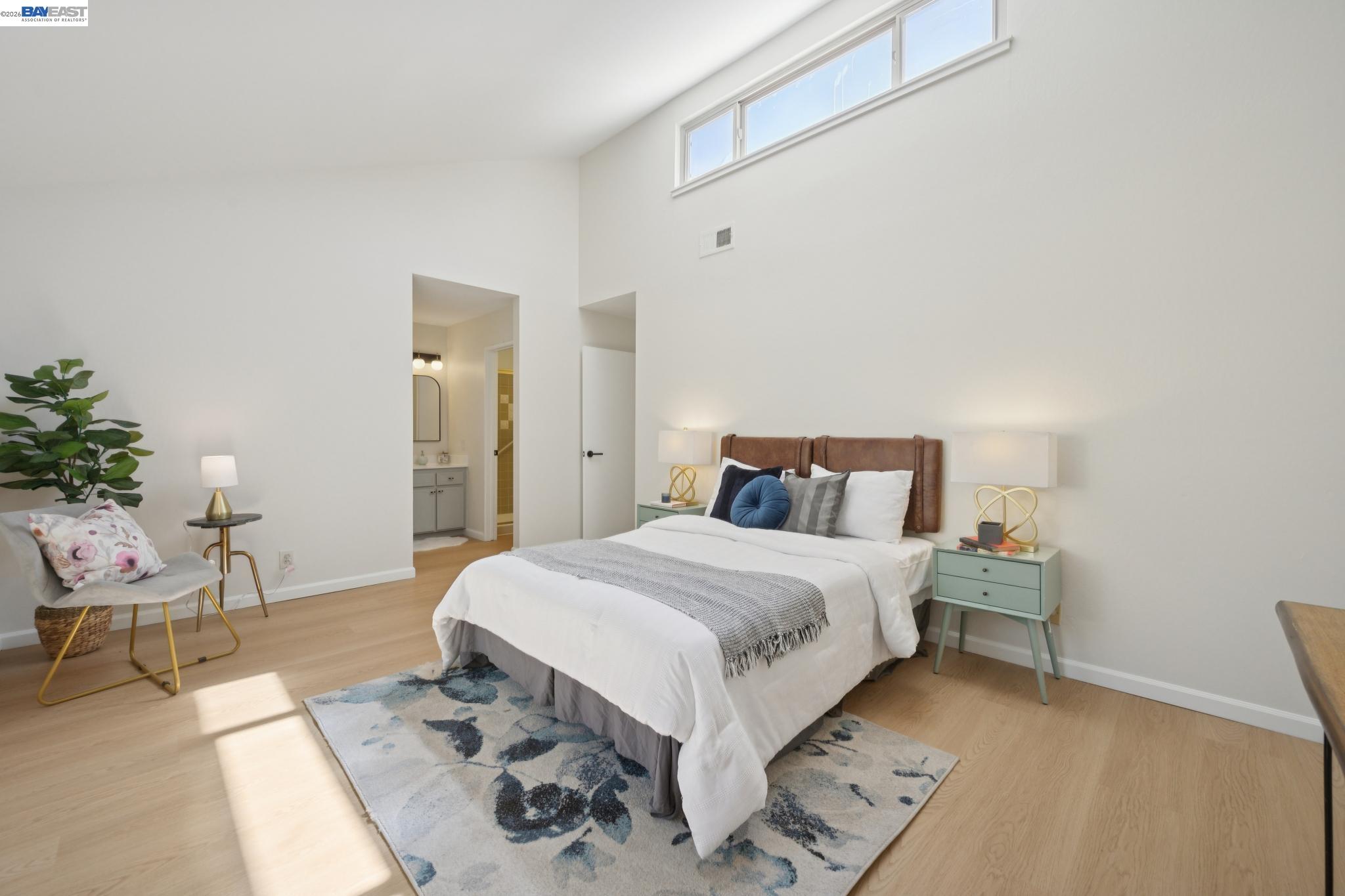 3201 Phoenix Lane Alameda, CA 94502 - Photo 29 of 58 a bedroom with a bed and a table