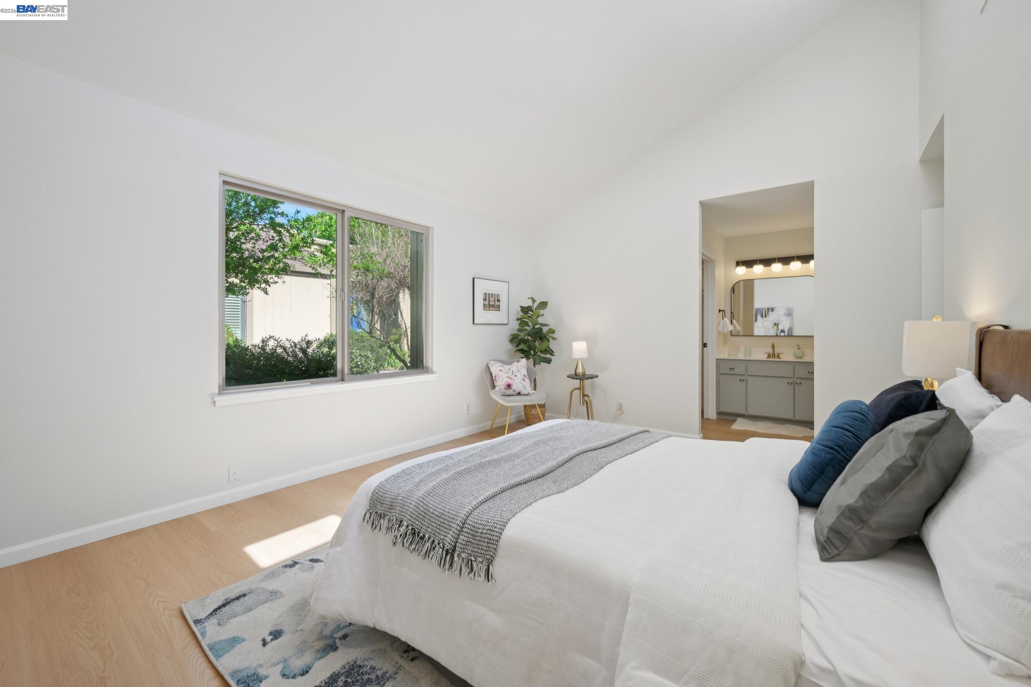 3201 Phoenix Lane Alameda, CA 94502 - Photo 30 of 58 a bedroom with a bed and a painting on the wall