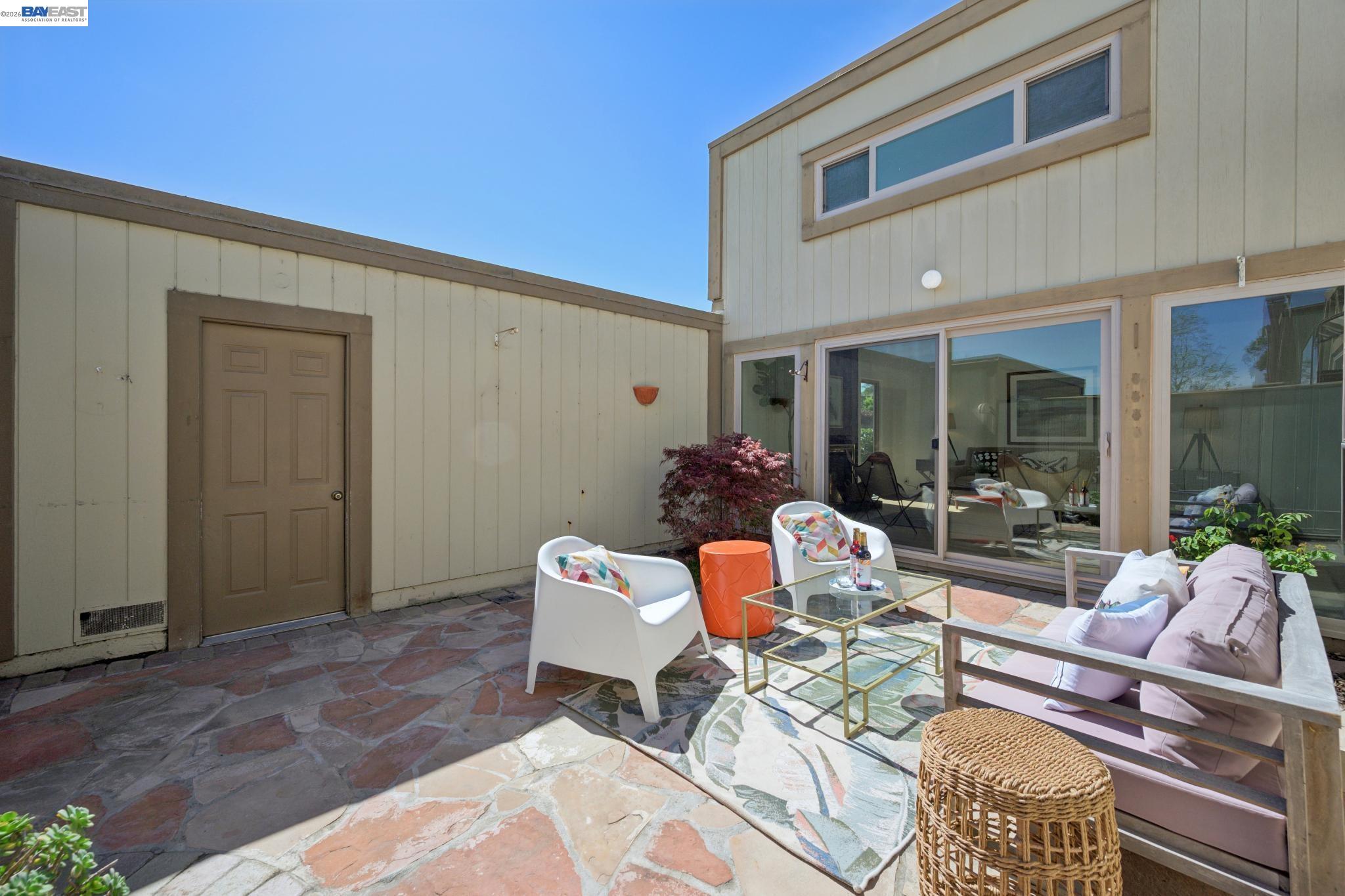 3201 Phoenix Lane Alameda, CA 94502 - Photo 35 of 58 a outdoor space with patio the couches and a dining table with the view of balcony