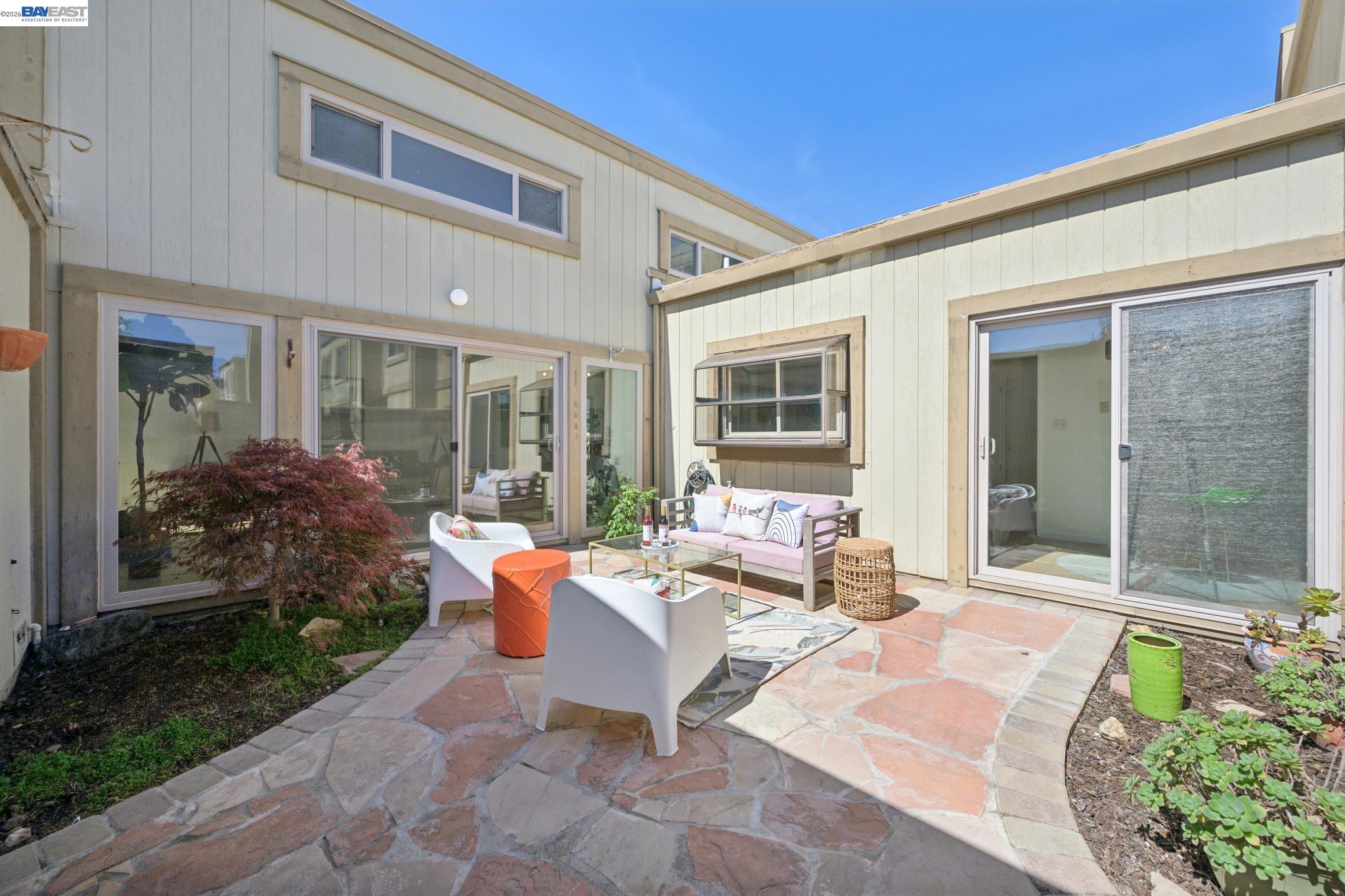 3201 Phoenix Lane Alameda, CA 94502 - Photo 36 of 58 a outdoor space with patio the couches and potted plants