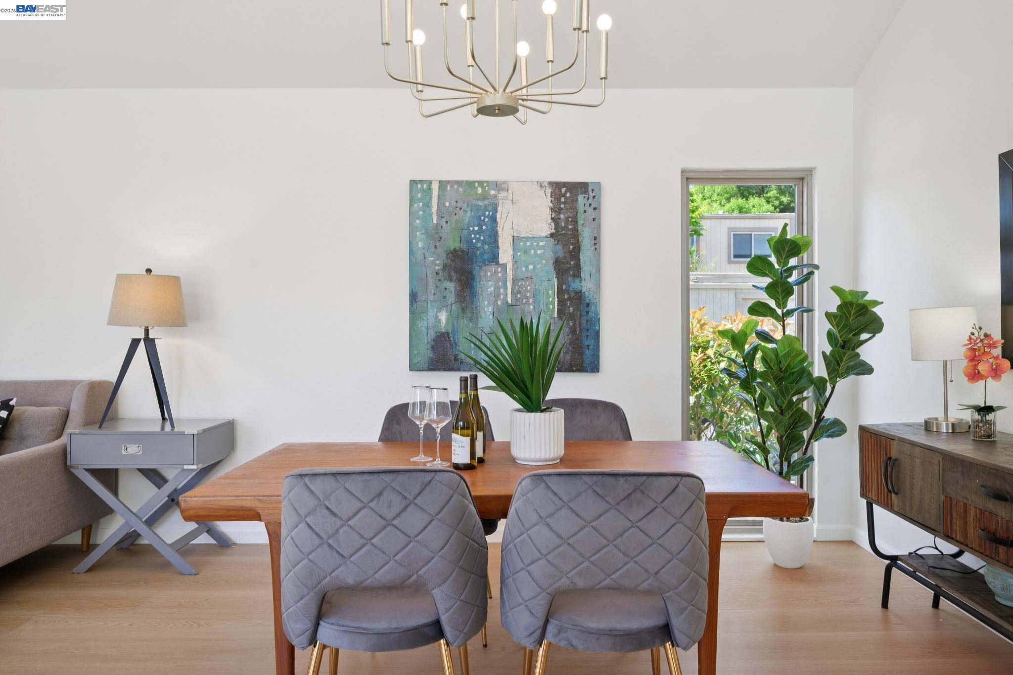3201 Phoenix Lane Alameda, CA 94502 - Photo 6 of 58 a view of a dining room with furniture and a potted plant