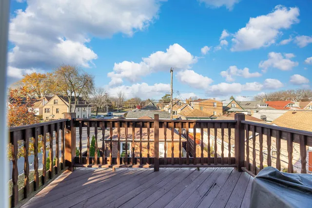 a view of a balcony with wooden floor