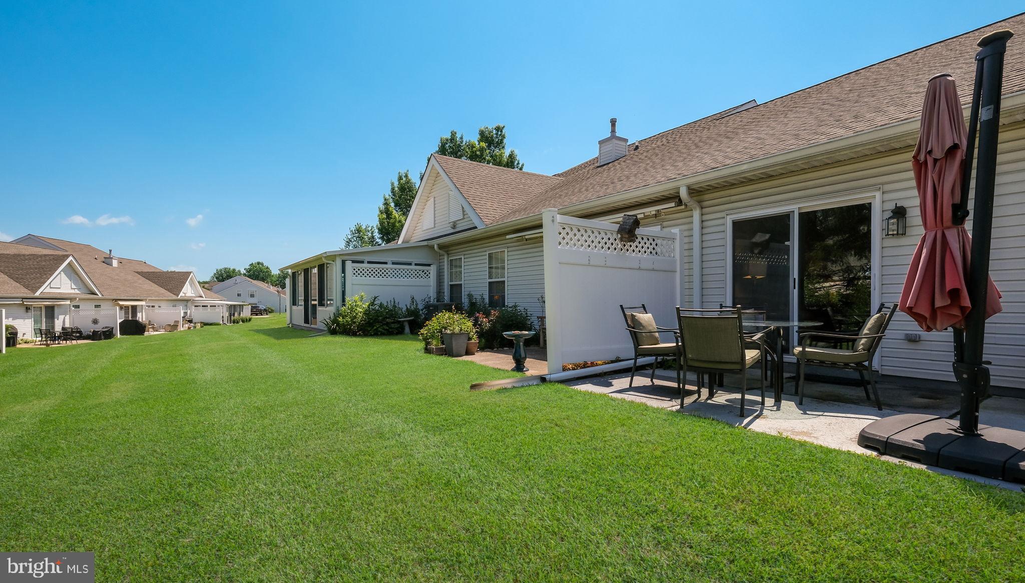 163 Progress Drive Doylestown, PA 18901 - Photo 35 of 35 Sunny backyard oasis with lush green lawn.