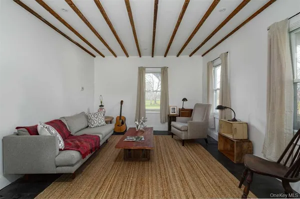 a kitchen with a checkered floor and a window
